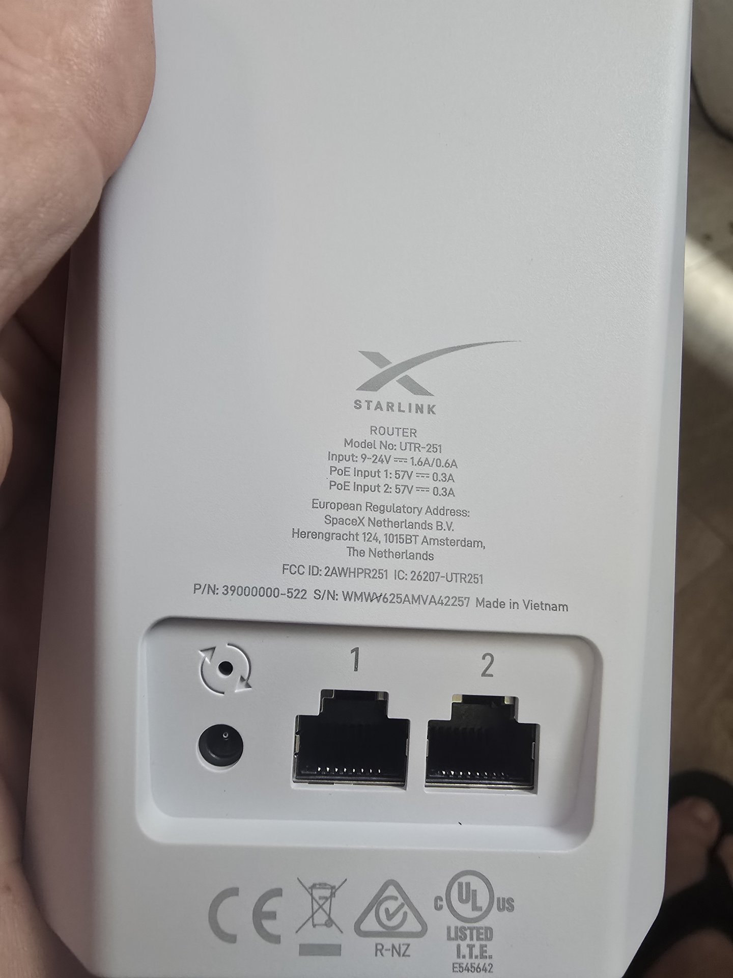 Starlink UTR-251 compact router label showing 9-24V input and dual 57V PoE inputs